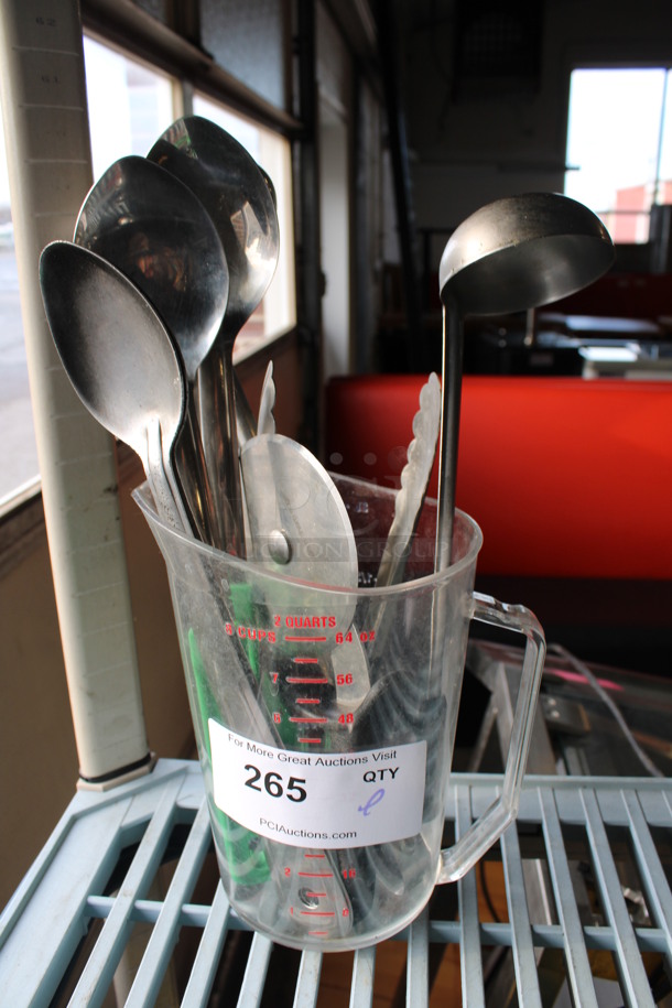 ALL ONE MONEY! Lot of Various Metal Utensils Including Serving Spoons, Ladle and Tongs in Clear Poly Pitcher. 