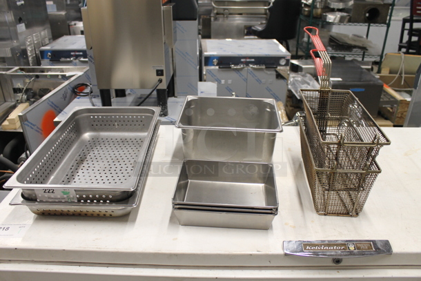 5 Items Including Two Perforated Food Pans, Two Drop-In Pans And Two Fryer Baskets. 5 Times Your Bid! 