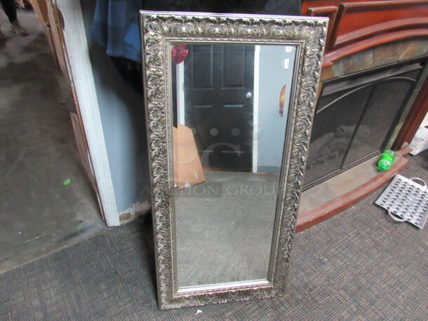 One 20X42 Framed Beveled Mirror.