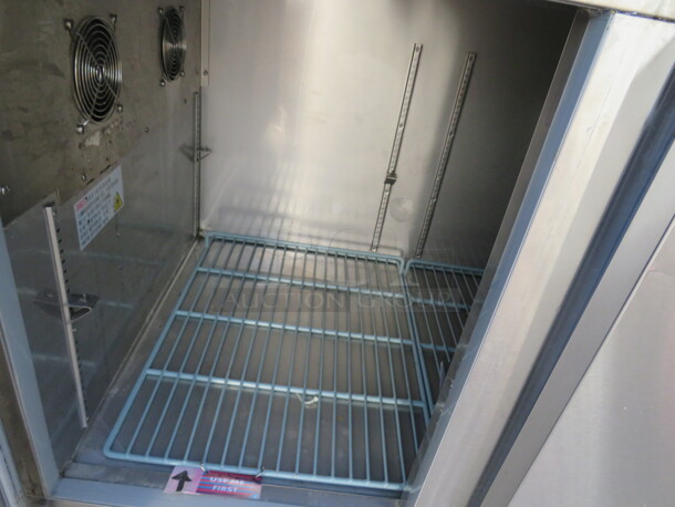One WORKING Stainless Steel 2 Door Avantco Refrigerated Prep Table, With 2 Racks, on Casters. Model# 178PICL260HC. 115 Volt. 60X31.5X43. $2199.00.  - Image 2 of 3
