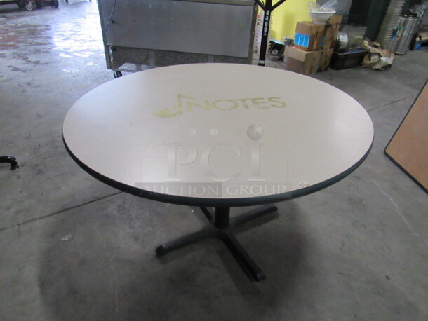One 60 Inch Round Beige Table Top On A Pedestal Base. 60X60X30