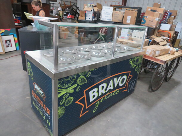 One 12 Pan Refrigerated Gelato Cabinet, With Sneeze Guards On Casters. #515. 120 Volt. 70X31X50.5.