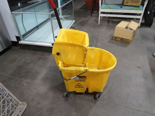 One Rubbermaid Mop Bucket And Wringer.  - Image 1 of 2