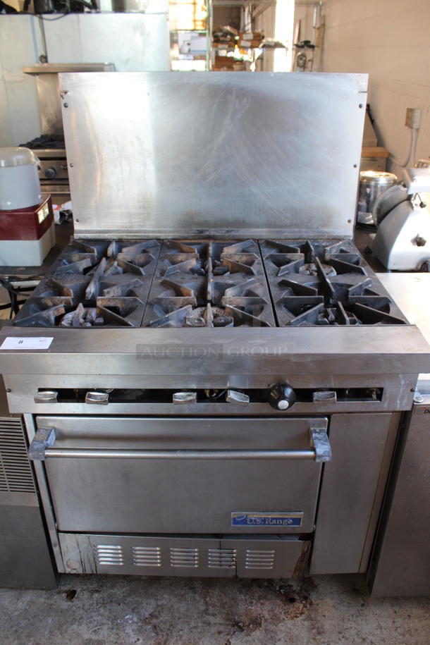 US Range Stainless Steel Commercial Propane Gas Powered 6 Burner Range w/ Oven and Backsplash on Commercial Casters. 36x33.5x57