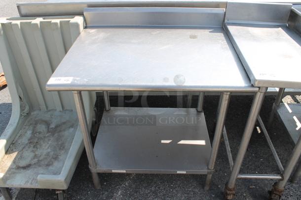 Stainless Steel Commercial Table w/ Back Splash and Under Shelf. - Image 1 of 4
