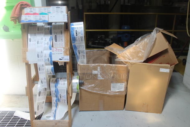 ALL ONE MONEY! Lot of Various Items Including Wooden Label Stand and 2 Cardboard Boxes of Poly Bottles. BUYER MUST REMOVE. - Image 1 of 6