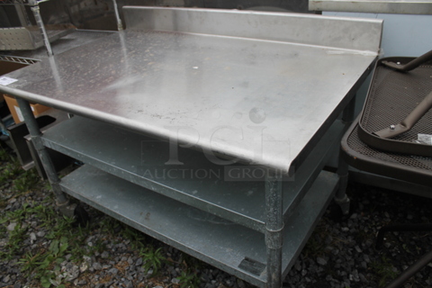 Eagle Stainless Steel Commercial Table w/ Back Splash and 2 Under Shelves on Commercial Casters.