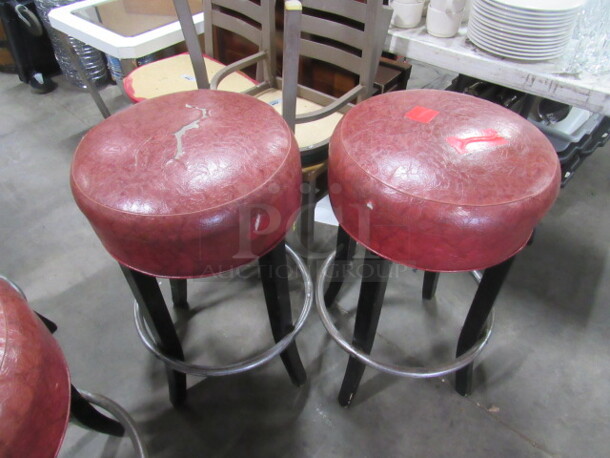 Bar Stool With A Red Cushioned Seat And Footrest. 2XBID