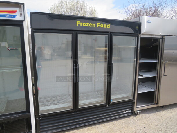 One 3 Door True Freezer With 12 Racks. Model# GDM-72F LD. 115-208/230 Volt. 72X30X80 - Image 1 of 5