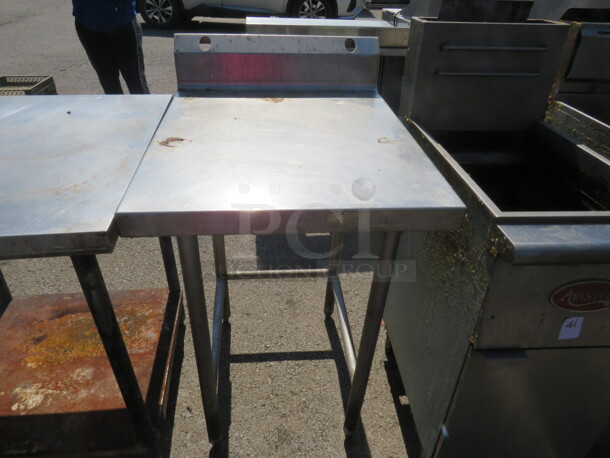 One Stainless Steel Table With Back Splash. 24X32X42