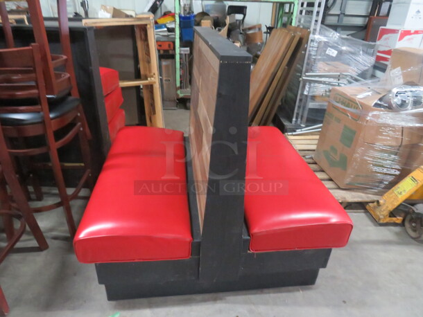 One Wooden Double Sided Booth With A Red Cushioned Seat. 47X45X45.5