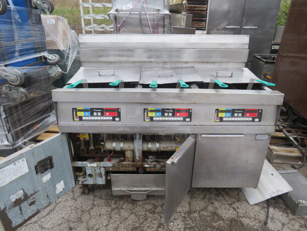 One Stainless Steel Natural Gas Triple FRYMASTER With 6 Baskets, And Filtration On Casters.  55.5X31X47. #HD50CSE - Item #1048056