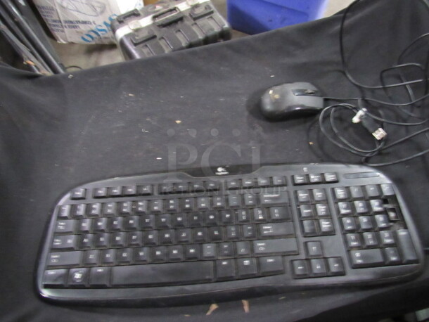 One Logitech Keyboard. Missing Key, With Mouse. 