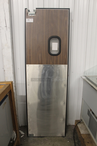 Stainless Steel and Wood Pattern Swinging Kitchen Door.