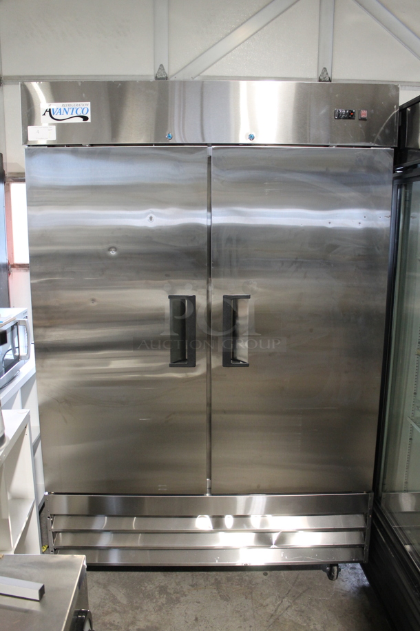 BRAND NEW SCRATCH AND DENT! 2022 Avantco 178A49RHC Stainless Steel Commercial 2 Door Reach In Cooler w/ Poly Coated Racks on Commercial Casters. 115 Volts, 1 Phase. Tested and Working! - Image 1 of 10