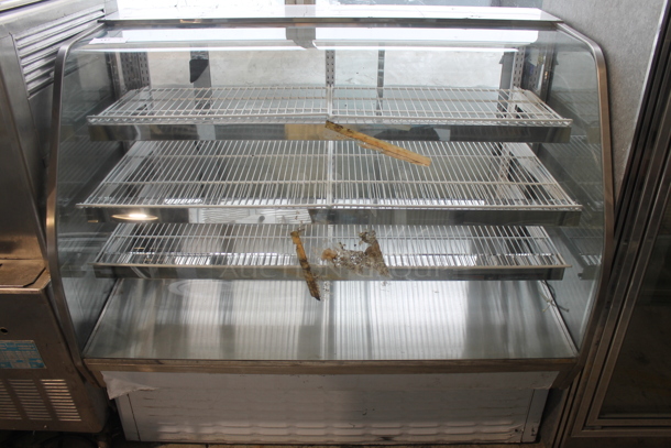 BRAND NEW SCRATCH AND DENT! CustomCool CGB57DRY Stainless Steel Commercial Floor Style Dry Display Case Merchandiser. - Image 1 of 6