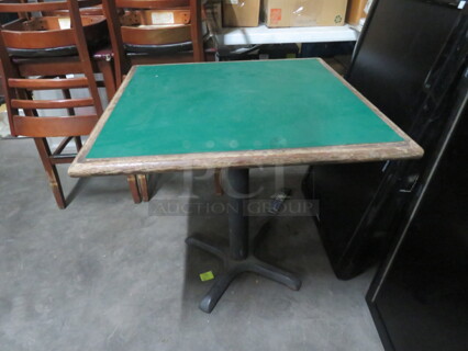 One Green Laminate Table Top On A Pedestal Base. 30X30X30