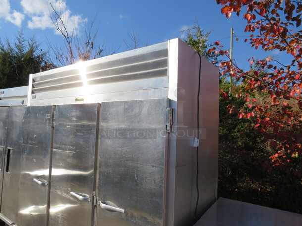 One Stainless Steel 3 Door Traulsen Refrigerator With 9 Shelves On Casters. 120 Volt. Model# G30011. 77X36X83.5 - Image 2 of 4