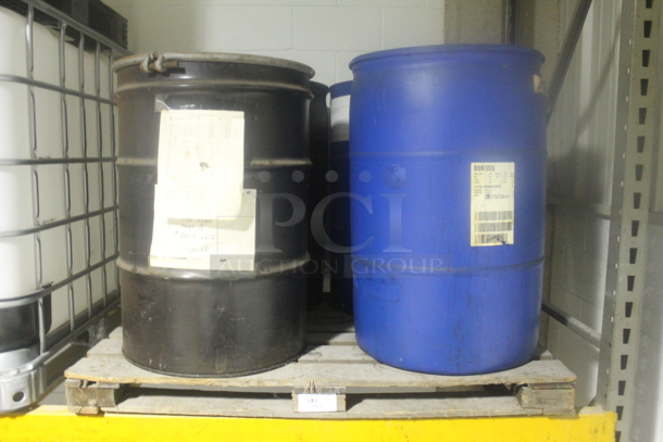 ALL ONE MONEY! PALLET LOT of 4 Barrels; 2 Black Metal and 2 Blue Poly.  BUYER MUST REMOVE. - Image 1 of 5