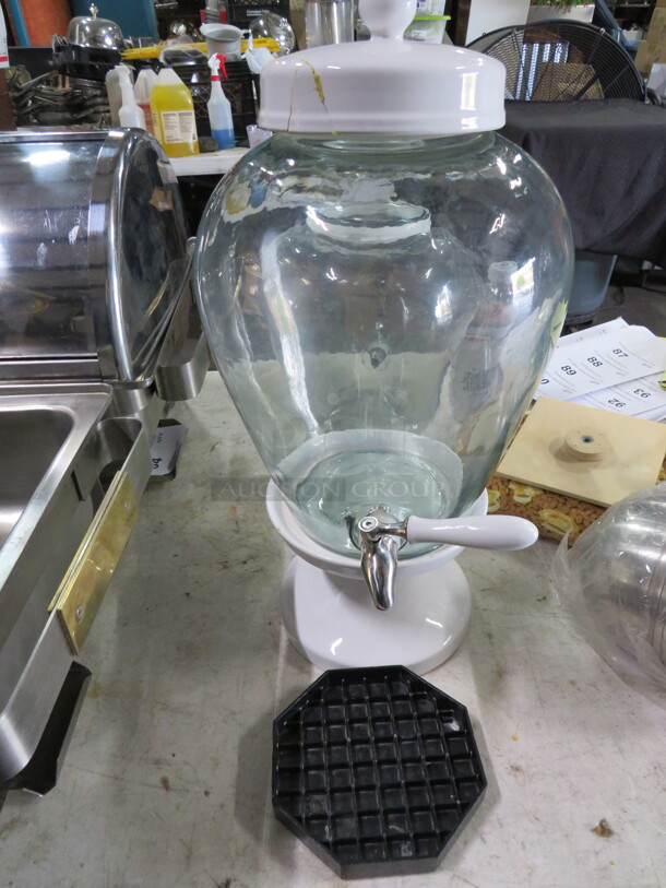 One Glass Beverage Dispenser With Lid And Stand. Lid Is Glued Together. - Image 1 of 2