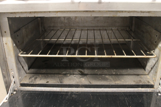 Vulcan Commercial Stainless Steel 6 Natural Gas Powered Burner Range With Standard Oven, Overshelf And Steel Racks.  - Image 4 of 6