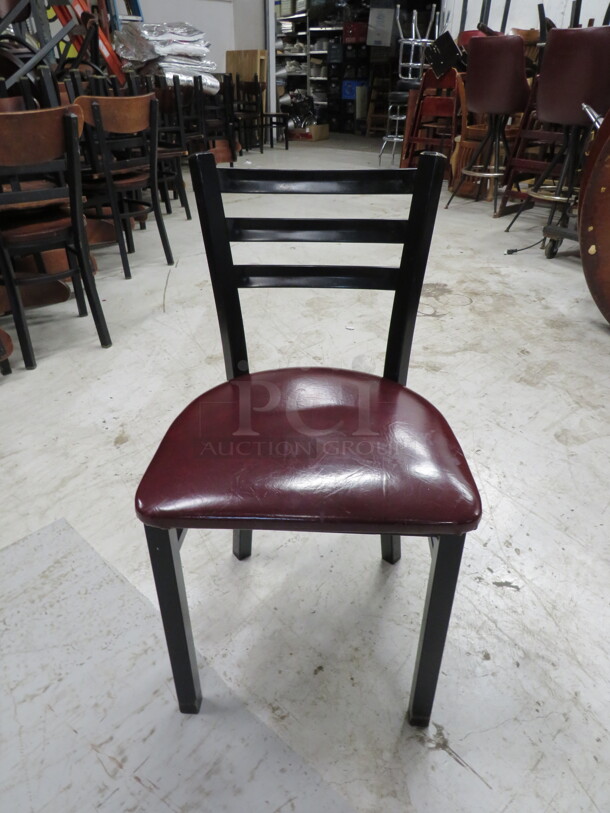 Black Metal Chair With A Burgundy Cushioned Seat. 4XBID. - Image 1 of 3