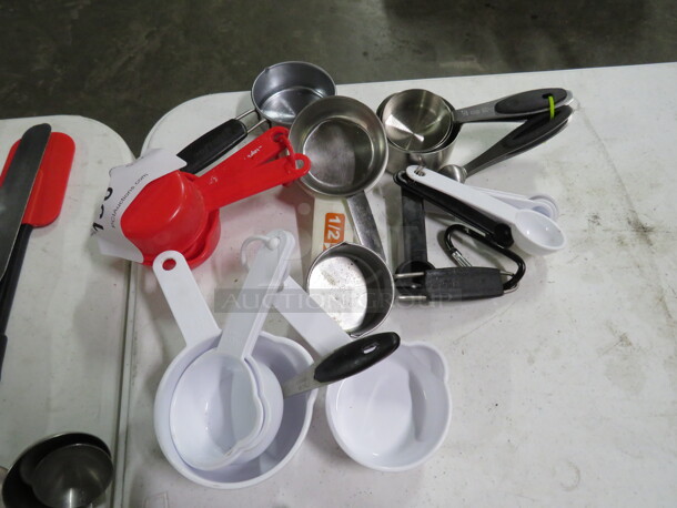 One Lot Of Assorted Measuring Cups/Spoons. - Image 1 of 1
