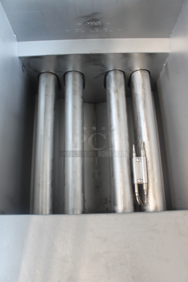 2019 Pitco Frialator 40D Stainless Steel Commercial Floor Style Natural Gas Powered Deep Fat Fryer w/ 2 Metal Fry Baskets on Commercial Casters. 107,000 BTU.  - Image 7 of 7