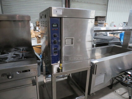 One SS Stellar Steam Pressure Steamer On Stand. Model# Capella. 208 Volt. 3 Phase. 24X29X60