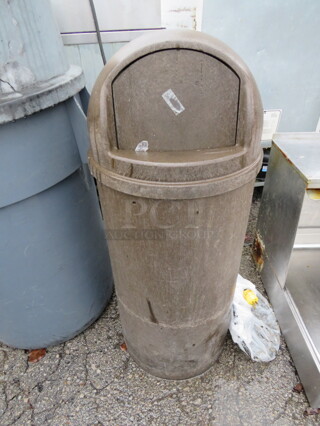 One Brown Trash Can With Dome, Flip Lid. 