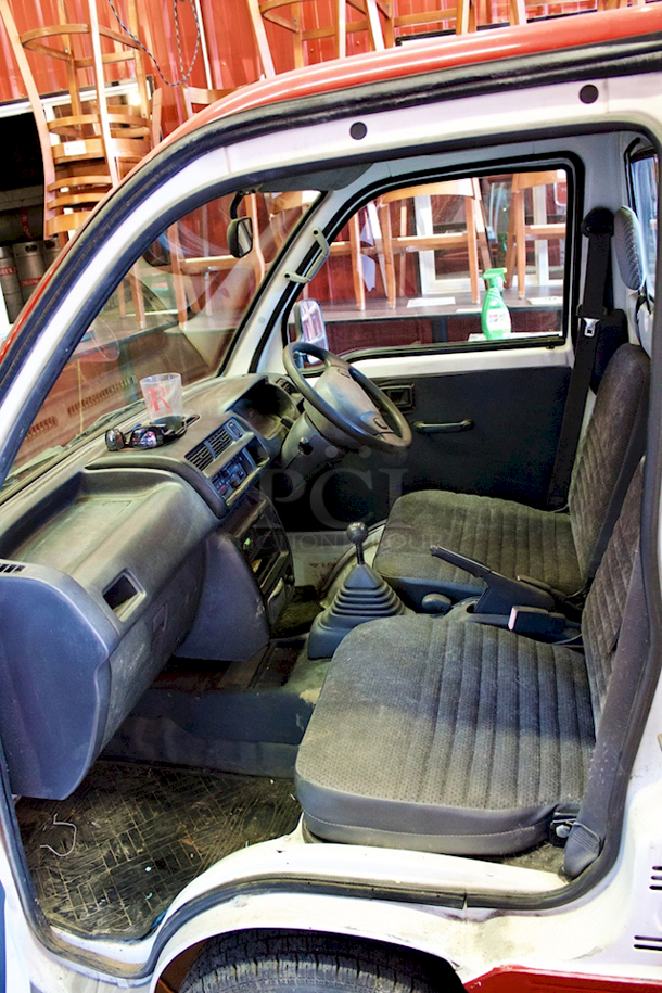 WORK HORSE! 1999/2000 Diahatsu Hijet S210P Pick-Up/Flatbed Truck. 64875Km / 40311 Miles - Runs Perfectly! 5-Speed Manual Transmission, 4 Wheel Drive, 600CC 3 Cylinder, Fuel Injected, Bed Converts From Pick-Up Truck To Flat Bed. Includes Spare Tire. Minor Rust On Flat Bed Panels - Driver side mirror needs to be re-attached. Includes All Original Paperwork. Made In Japan. - Image 6 of 12