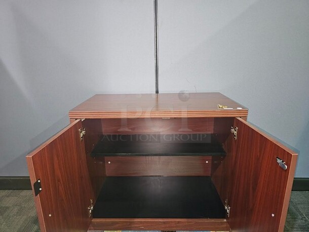 Locking cabinet with shelf. Has set of keys- very nice piece! 36” W x 29.5” H x 20” D.  

  - Image 2 of 3