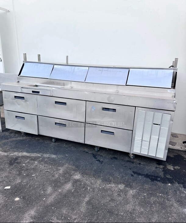 Working Delfield F18RC114 114 inch Three Door Refrigerated Pizza Prep Table - Image 1 of 8