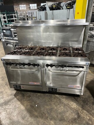 Southbend Commercial Natural Gas Powered 12 Burner Stove! With Raised Back Splash And Salamander Shelf! With 2 Full Size Oven Underneath! All Stainless Steel! On Casters! Working When Removed!