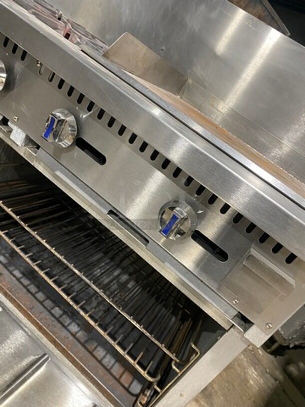 Patriot Commercial Natural Gas Powered 6 Burner Stove With Flat Griddle! Flat Griddle Has Side Splashes! With Raised Back Splash! With 2 Oven Underneath! Metal Oven Racks! All Stainless Steel! On Casters! WORKING WHEN REMOVED! - Image 11 of 12