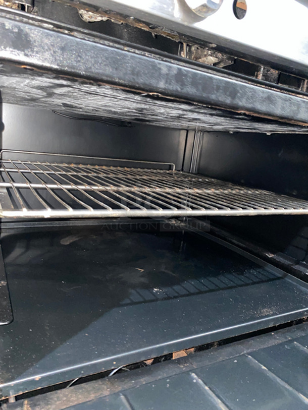 Sweet! Imperial Commercial Natural Gas Powered 6 Burner Stove With Left Side Flat Top Griddle! 2 Full Size Ovens Underneath! With Metal Oven Racks! Left Side Splash And Raised Back Splash!  All Stainless Steel! On Casters! - Image 9 of 11