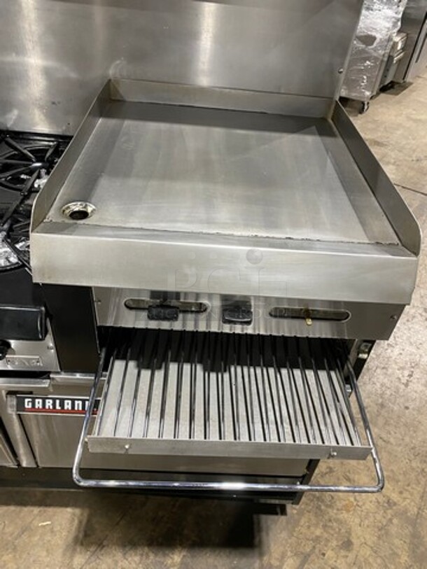 GREAT FIND! Garland Commercial Gas Powered 6 Burner Stove With Right Side Flat Griddle! Griddle Has Side Splashes! With Raised Back Splash And Salamander Shelf! With 2 Oven Underneath! Metal Oven Racks! All Stainless Steel! On Casters! Working When Removed! - Image 8 of 12