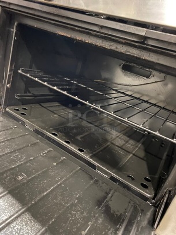 AMAZING FIND! Garland Natural Gas Powered 12 Burner Stove! With 2 Full-Sized Ovens! With Metal Oven Racks! With Raised Back Splash & Salamander Shelf! Stainless Steel! On Casters! WORKING WHEN REMOVED! - Image 8 of 11