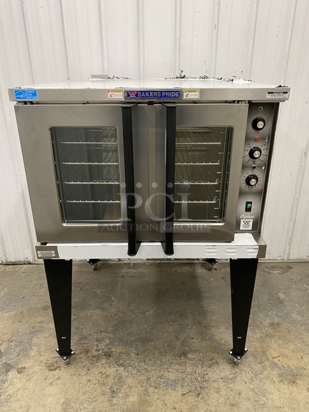 BRAND NEW! LATE MODEL! Baker's Pride Model BCO-E1 ENERGY STAR Stainless Steel Commercial Electric Powered Full Size Convection Oven w/ View Through Doors, Metal Oven Racks and Thermostatic Controls on Metal Legs. Oven Is In Crate. 240 Volts, 1 Phase. 38x39x55.5