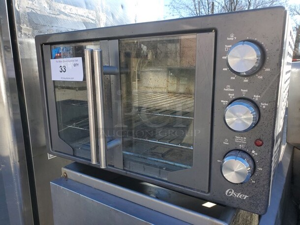 OSTER TSSTTVFDXL-CH Toaster Oven 120V 22X14X13 - Image 1 of 3