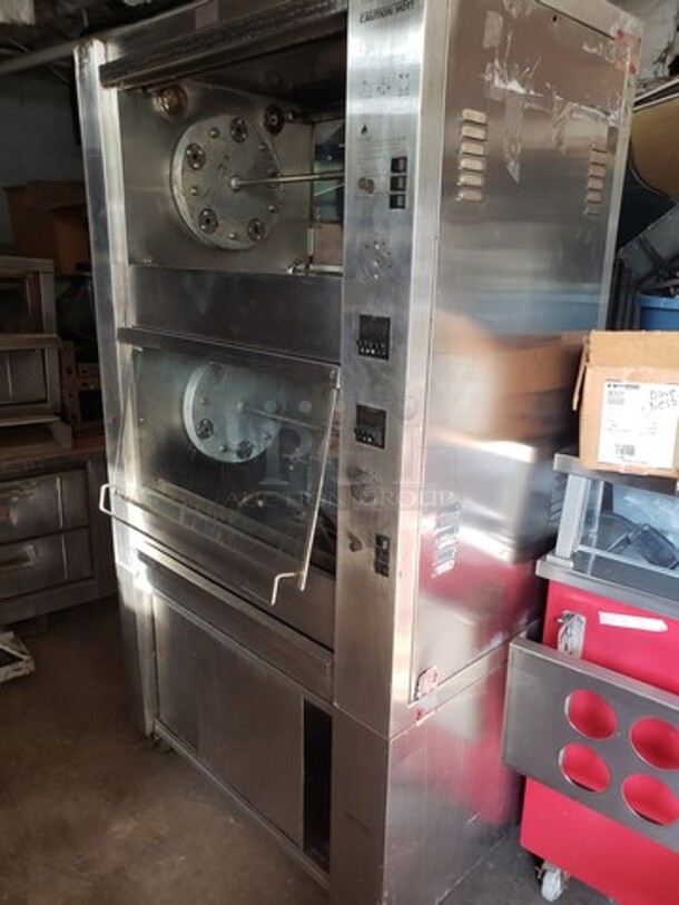 Hickory 10.10E Electric Rotisserie Oven on Casters! Left side of the oven has a small dent. Missing one knob and one knob is broken and needs to be replaced. 

Motor 120V, 1PH
Heating Elements 208V, 3PH - Image 5 of 10