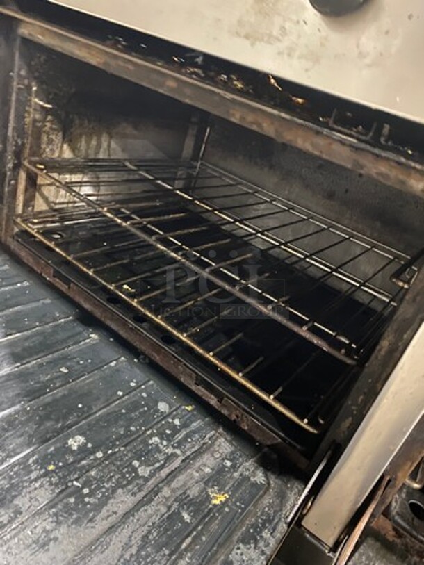 Garland Commercial Natural Gas Powered 6 Burner Stove With Right Side Flat Griddle! Griddle Has Side Splashes! With Raised Back Splash And Salamander Shelf! With 2 Oven Underneath! Metal Oven Racks! All Stainless Steel! On Legs! Working When Removed! - Image 9 of 9