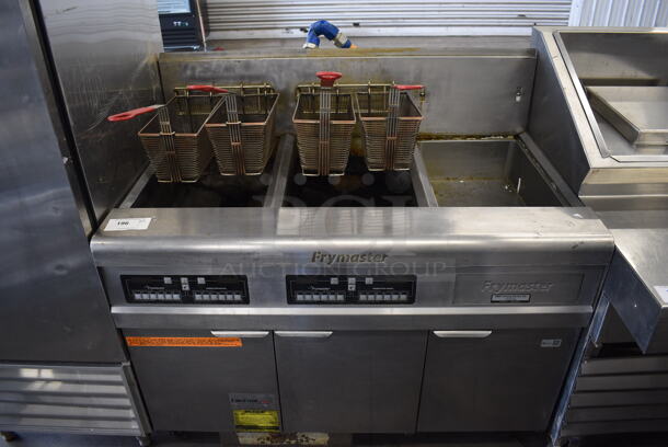 2011 Frymaster FMPH255CSE Stainless Steel Commercial Propane Gas Powered 2 Bay Deep Fat Fryer w/ 4 Metal Fry Baskets and Right Side Dumping Station on Commercial Casters. 80,000 BTU. 47x30x47