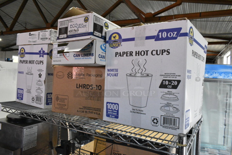 6 BRAND NEW Boxes Including Paper Hot Cups 10 oz, LHRDS-10 Graphic Lids, SKYF3036HB 20-30 Gallon Bags, Eco Java Jacket, Paper Hot Cups 8 oz, HCR-242406C Clear Bags. 6 Times Your Bid! 