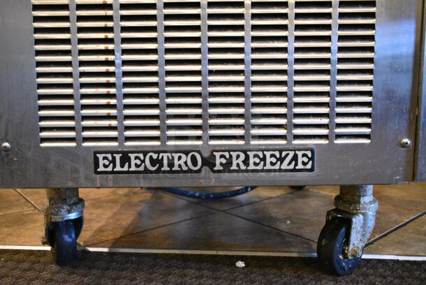 Electro Freeze SL500-132 Stainless Steel Commercial Floor Style Water Cooled 2 Flavor w/ Twist Soft Serve Ice Cream Machine on Commercial Casters. 208-230 Volts, 3 Phase. This Unit Was In Working Condition When the Restaurant Closed. (main dining room) - Image 8 of 10