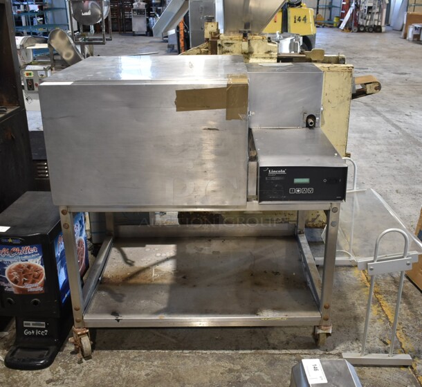 Lincoln Impinger Stainless Steel Commercial Electric Powered Single Deck Conveyor Pizza Oven on Commercial Casters Missing Conveyor. 3 Phase. - Image 1 of 5