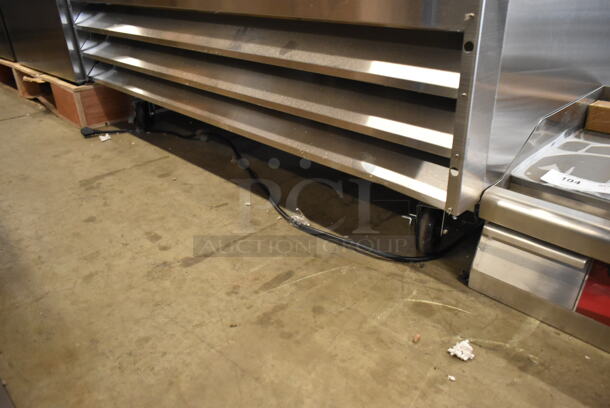 BRAND NEW SCRATCH AND DENT! 2024 Avantco 178A49FHC Stainless Steel Commercial 2 Door Reach In Freezer w/ Poly Coated Racks on Commercial Casters. 115 Volts, 1 Phase. Tested and Working! - Image 4 of 7