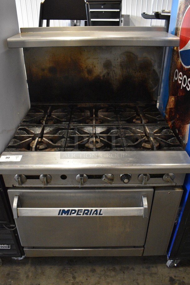 Imperial Stainless Steel Commercial Natural Gas Powered 6 Burner Range w/ Oven, Over Shelf and Back Splash on Commercial Casters. 36x34x57