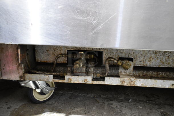 Radiance Stainless Steel Commercial Natural Gas Powered 6 Burner Range w/ Oven, Over Shelf and Back Splash on Commercial Casters. 2 Casters Need To Be Reattached. - Image 5 of 5