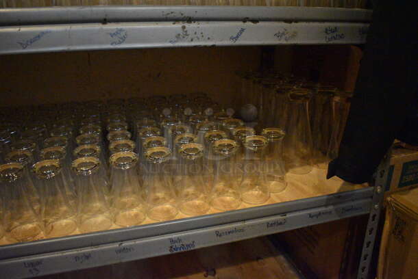 Gray Metal 5 Tier Shelving Unit w/ Contents Including Beverage Glasses and Wine Glasses. 48x24x72. BUYER MUST REMOVE; BUYER MUST DISMANTLE. PCI CANNOT DISMANTLE FOR SHIPPING. PLEASE CONSIDER FREIGHT CHARGES. (glass room - off of bar area) - Image 8 of 10